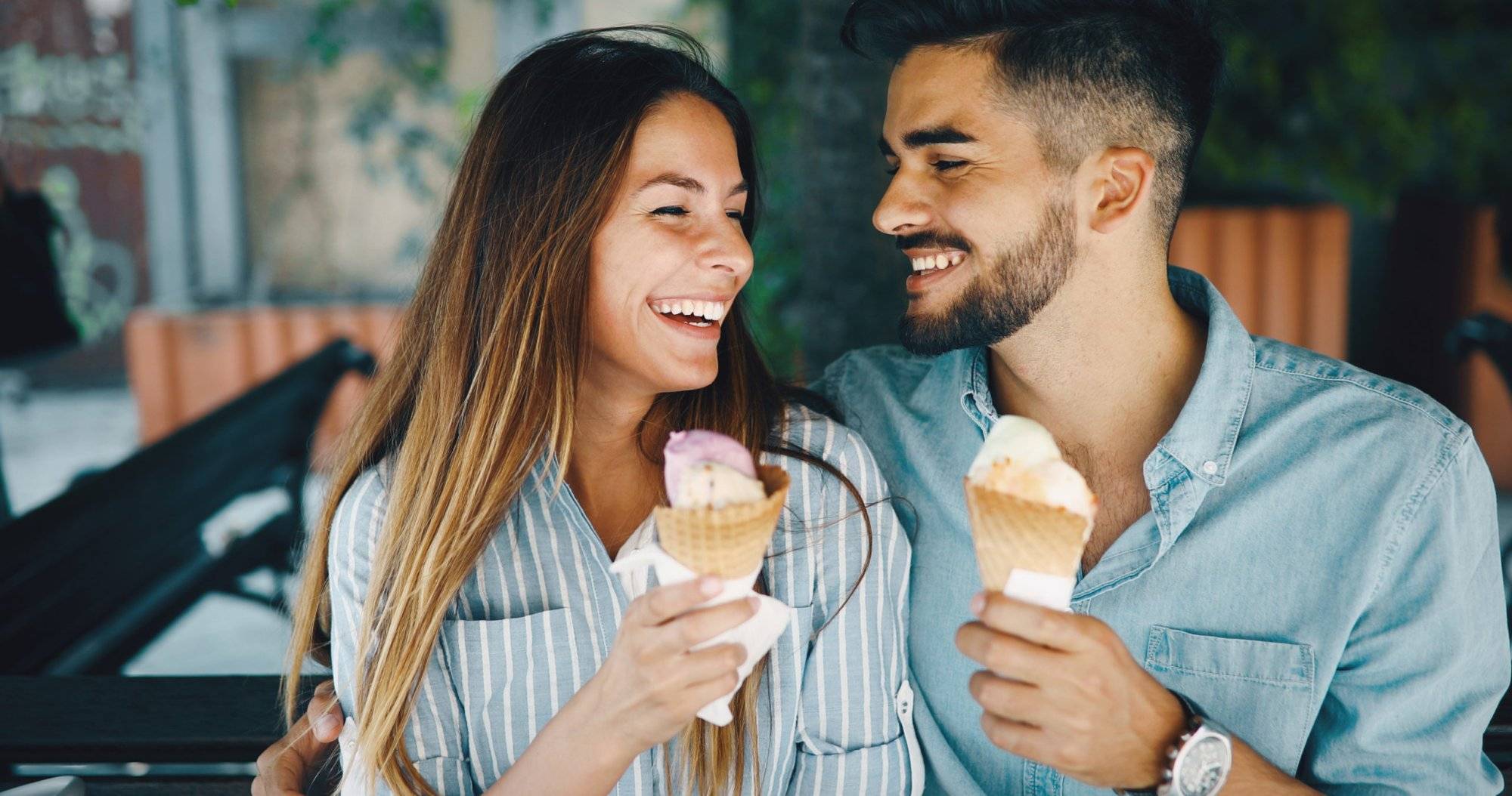 Happy couple having date and eating ice cream Happy couple having date and eating ice cream