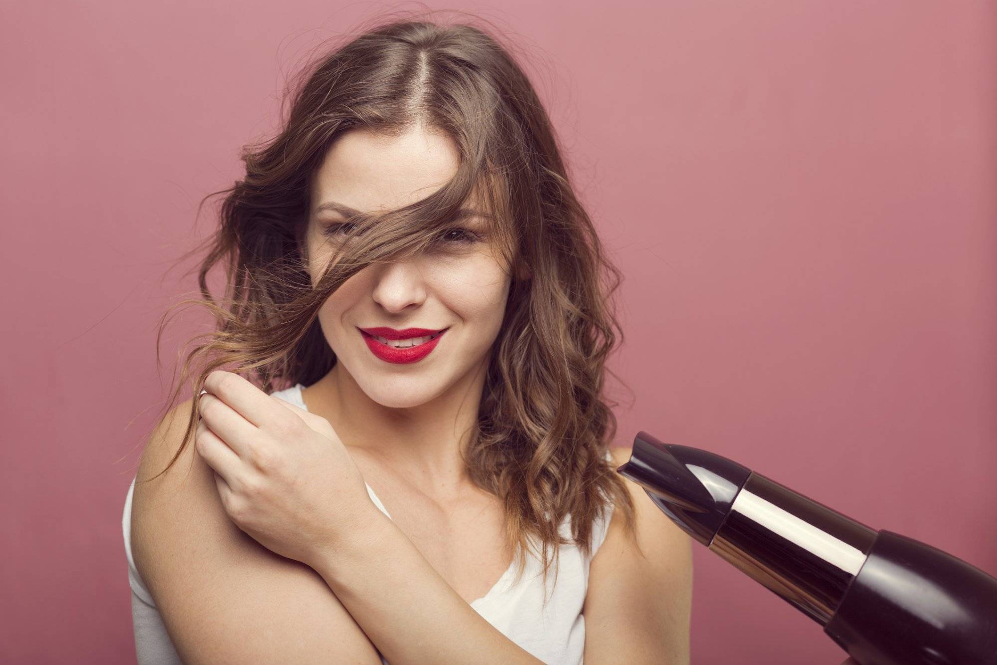 Sexy woman with a hair dryer